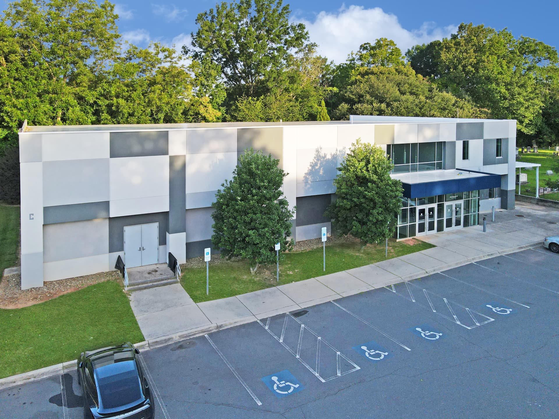 Modern education building exterior with covered entrance